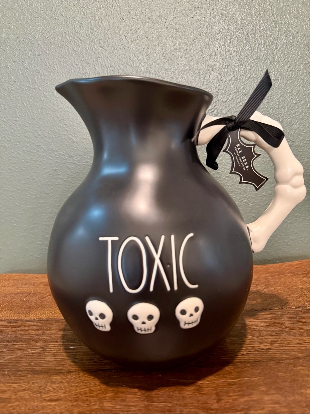 Rae Dunn Black "TOXIC" Skull Pitcher with Bone Handle